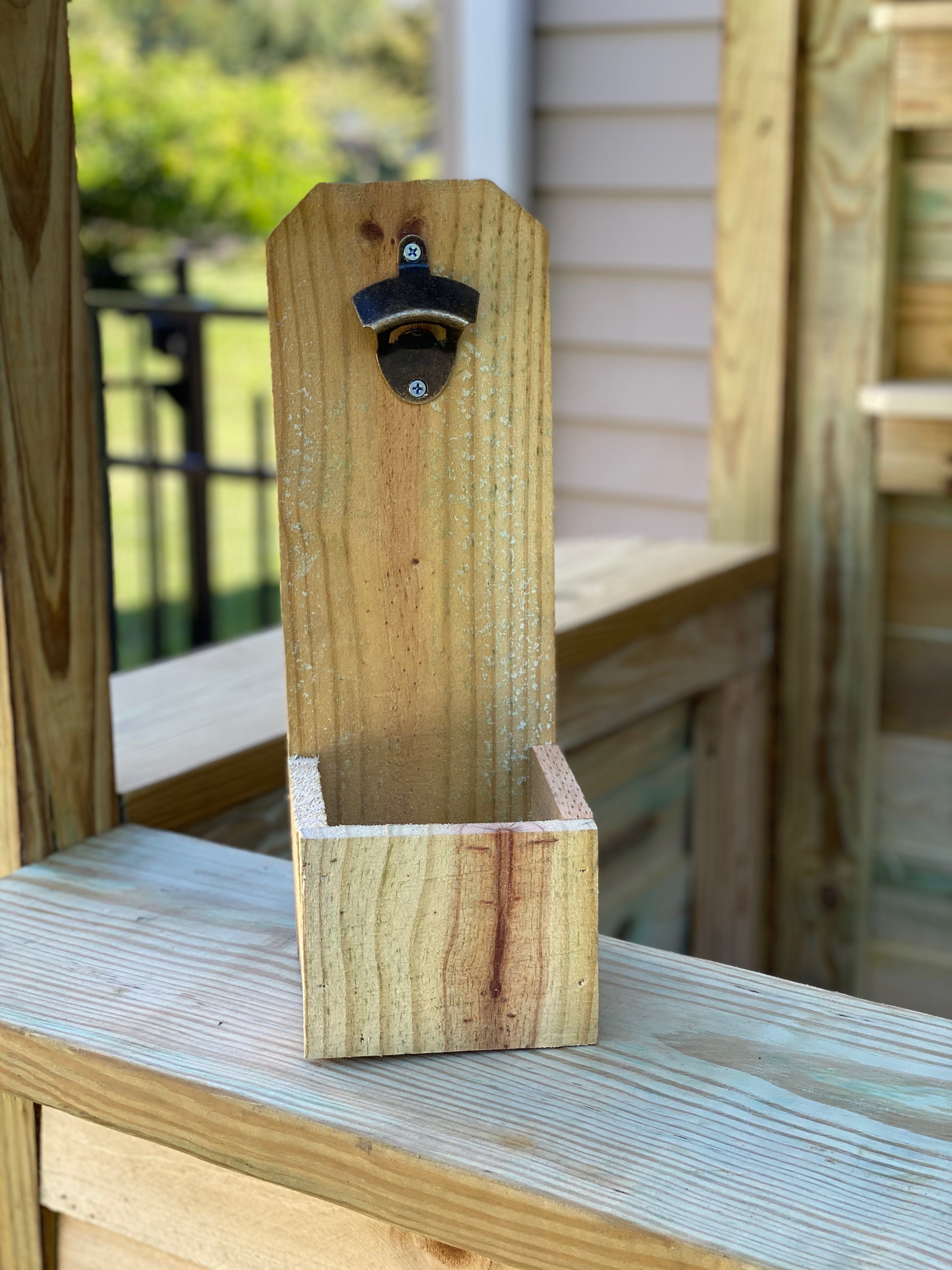 Bottle opener with cap catch