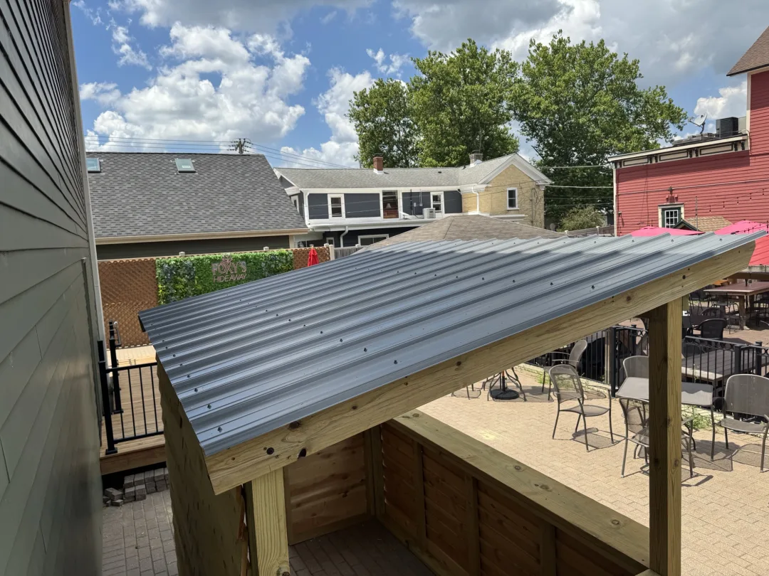 Exterior-ready patio bar with warm wood tones and clean builder-made trim work